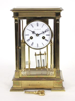 Lot 929 - A brass four-glass mantel clock by The London...