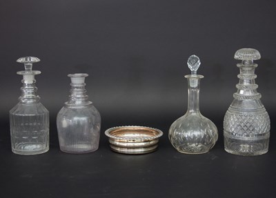 Lot 942 - Four cut glass decanters, three stoppers and a...