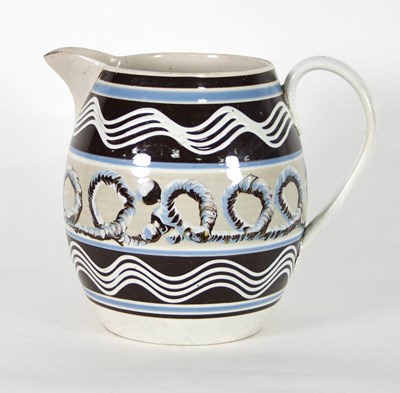 Lot 956 - A 19th Century Mocha ware jug, typically...