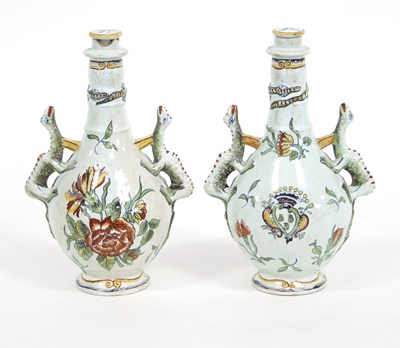 Lot 970 - A pair of faience two-handled vases and covers,...