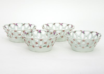 Lot 982 - A set of four small circular Worcester baskets,...