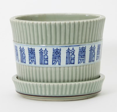 Lot 1015 - A Chinese celadon jardini?re and stand,...