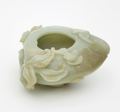 Lot 1027 - A Chinese jade brush washer, carved as a peach...