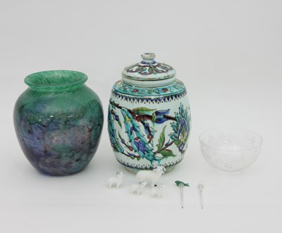 Lot 1030 - An Isnik jar and cover, 23cm high, a green and...