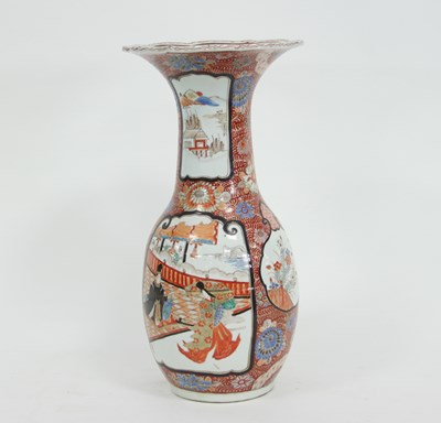 Lot 1043 - A Japanese Imari vase, the flanged top...