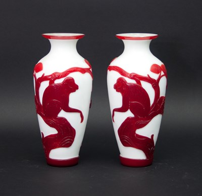 Lot 1063 - A pair of Chinese cameo glass vases, of...