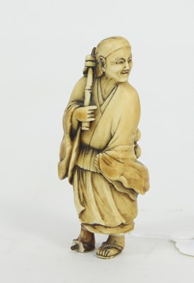 Lot 1070 - A carved okimono, Meiji period, depicting a...