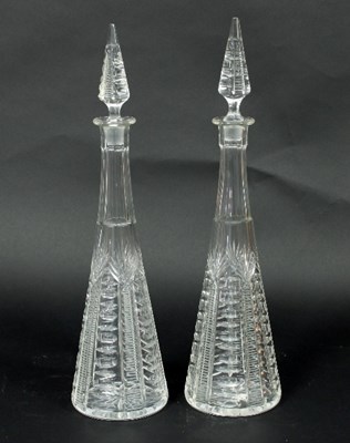 Lot 1 - A pair of tall cut glass decanters with...