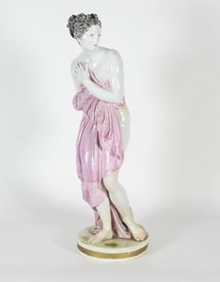 Lot 53 - An Italian glazed figure of a semi-clad maiden...