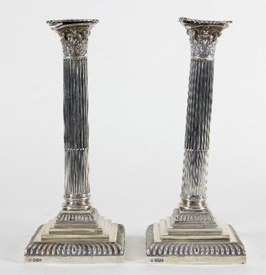 Lot 87 - A pair of late Victorian silver candlesticks,...