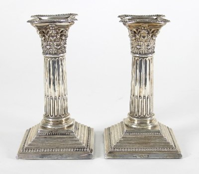 Lot 88 - A pair of late Victorian silver candlesticks,...