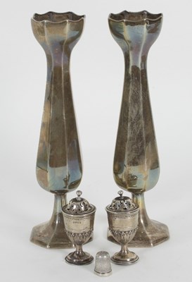 Lot 94 - A pair of octagonal tulip shaped silver vases,...