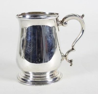 Lot 99 - A silver mug, HA, Sheffield 1918, of baluster...