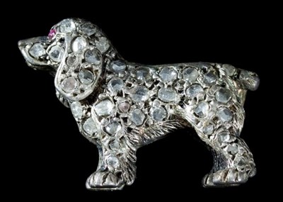 Lot 127 - A diamond brooch of spaniel form, pave set...