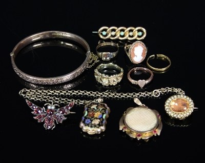 Lot 137 - A gem set moth brooch, a 9ct gold bangle, a...