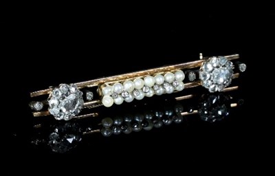 Lot 139 - A diamond and pearl bar brooch, centred by a...