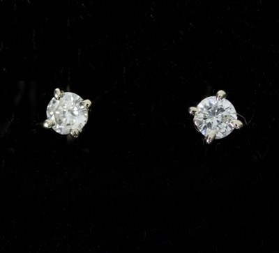 Lot 151 - A pair of diamond ear studs set in 18ct white...