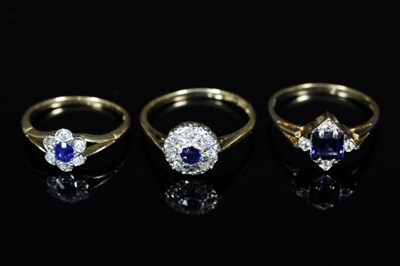 Lot 155 - A sapphire and diamond cluster ring, the nine...