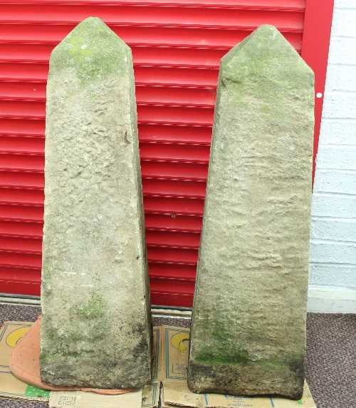 Lot 450 - Two stone garden obelisks, each of similar