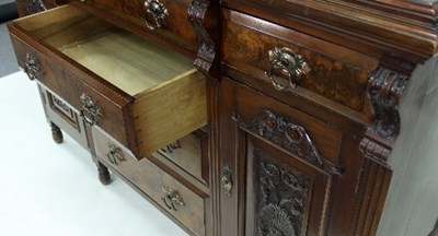 Lot 457 - A mahogany and walnut sideboard fitted with...