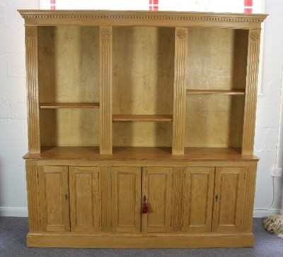 Lot 480 - A large pine bookcase, the top section of...