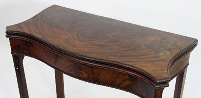 Lot 508 - A George II mahogany serpentine card table on...