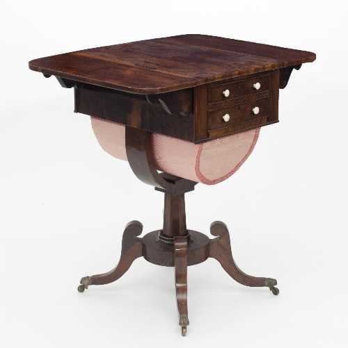 Lot 517 - A Regency rosewood work table with two flaps