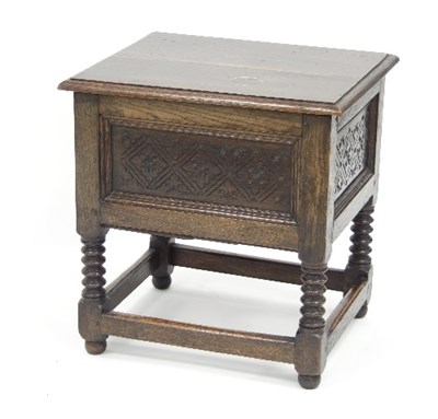 Lot 526 - An oak box top chest with hinged cover and...