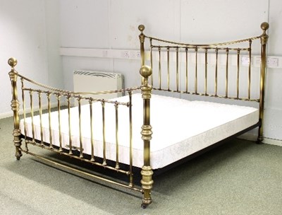 Lot 540 - A brass bedstead with tubular rails and ball...