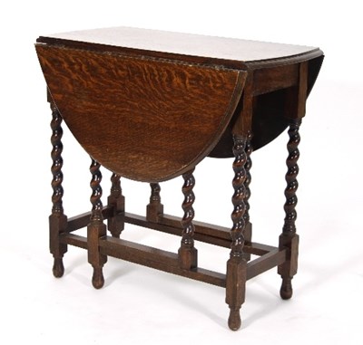 Lot 541 - An oak oval two-flap gate-leg table, on spiral...