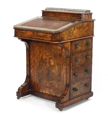 Lot 543 - A mid Victorian figured walnut Davenport, with...