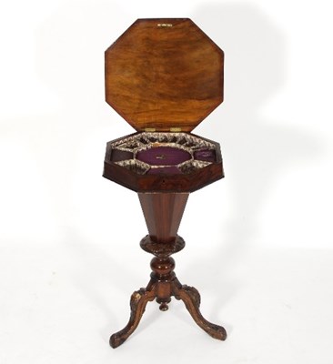 Lot 551 - A Victorian walnut octagonal work table with...