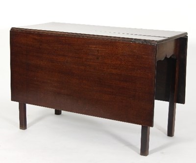 Lot 552 - A George III mahogany two-flap table on square...