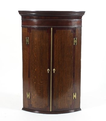 Lot 559 - An early 19th Century oak and mahogany corner...