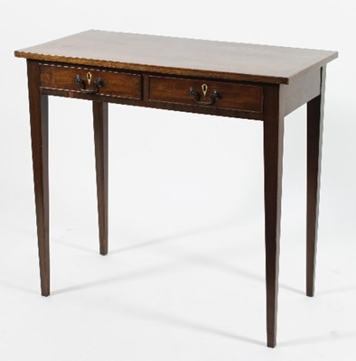 Lot 560 - A George III mahogany table, fitted two...