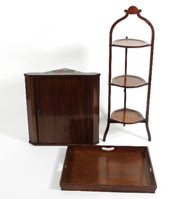 Lot 562 - A mahogany corner cupboard, enclosed by a...