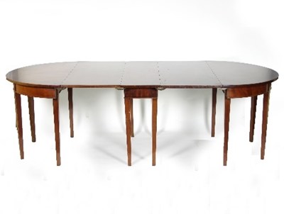 Lot 563 - A mahogany Georgian style dining table, with...