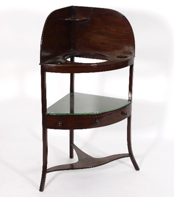 Lot 567 - A Regency mahogany corner washstand, with...