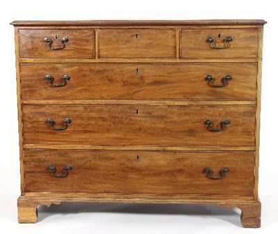 Lot 572 - A George III mahogany chest of three long and...