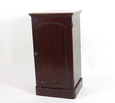 Lot 574 - A mahogany pedestal cupboard, enclosed by an...