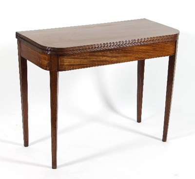 Lot 575 - A late Regency mahogany tea table with folding...