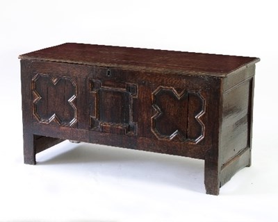 Lot 584 - An oak coffer with plain hinged cover and...