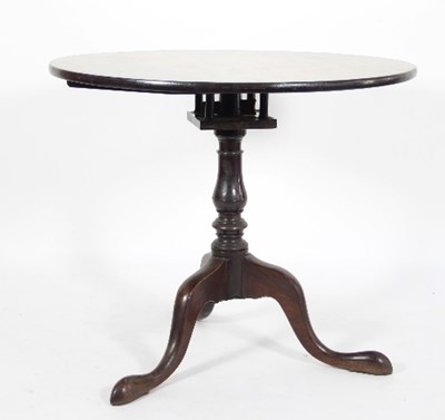 Lot 595 - A George III mahogany table on a revolving...