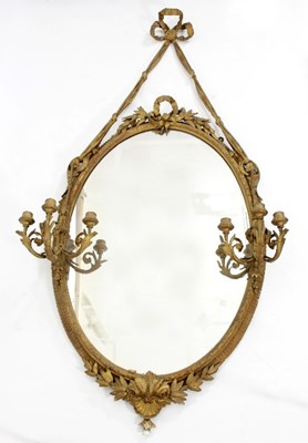 Lot 599 - An oval gilt-plaster wall mirror with...