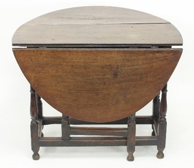 Lot 600 - An oak two-flap gateleg table of 18th Century...