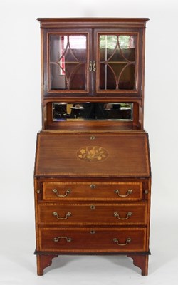 Lot 604 - An Edwardian mahogany bureau with bookcase and...