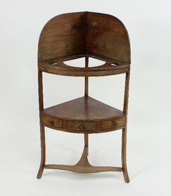 Lot 611 - A Regency corner washstand with pierced top...