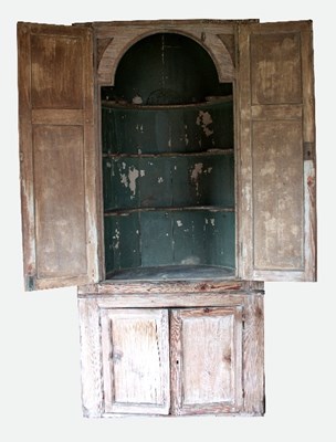 Lot 614 - An early 19th Century pine recess cupboard...