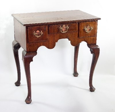 Lot 617 - A George II walnut kneehole with geometric...