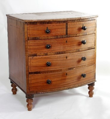 Lot 622 - An early 19th Century satinwood bowfront chest,...